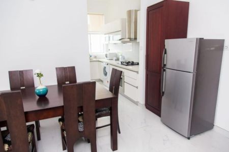 Dining room - Beach Front 2 Bedroom Condo | Pool + Gym