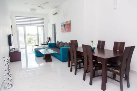 Dining room - Beach Front 2 Bedroom Condo | Pool + Gym